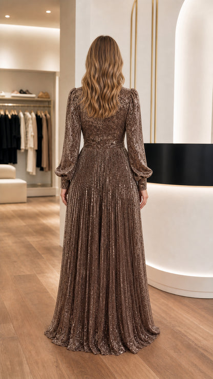 Back view of model in floor-length Bronze sequin pleated dress