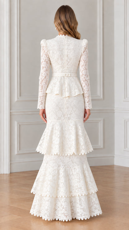 Back view of woman wearing white long sleeve lace evening gown with peplum waist