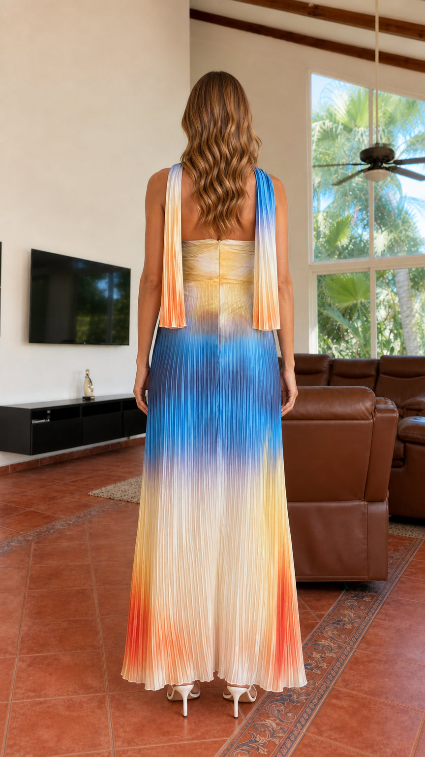 Back view of blue ombré pleated maxi gown showing draped scarf details down the back