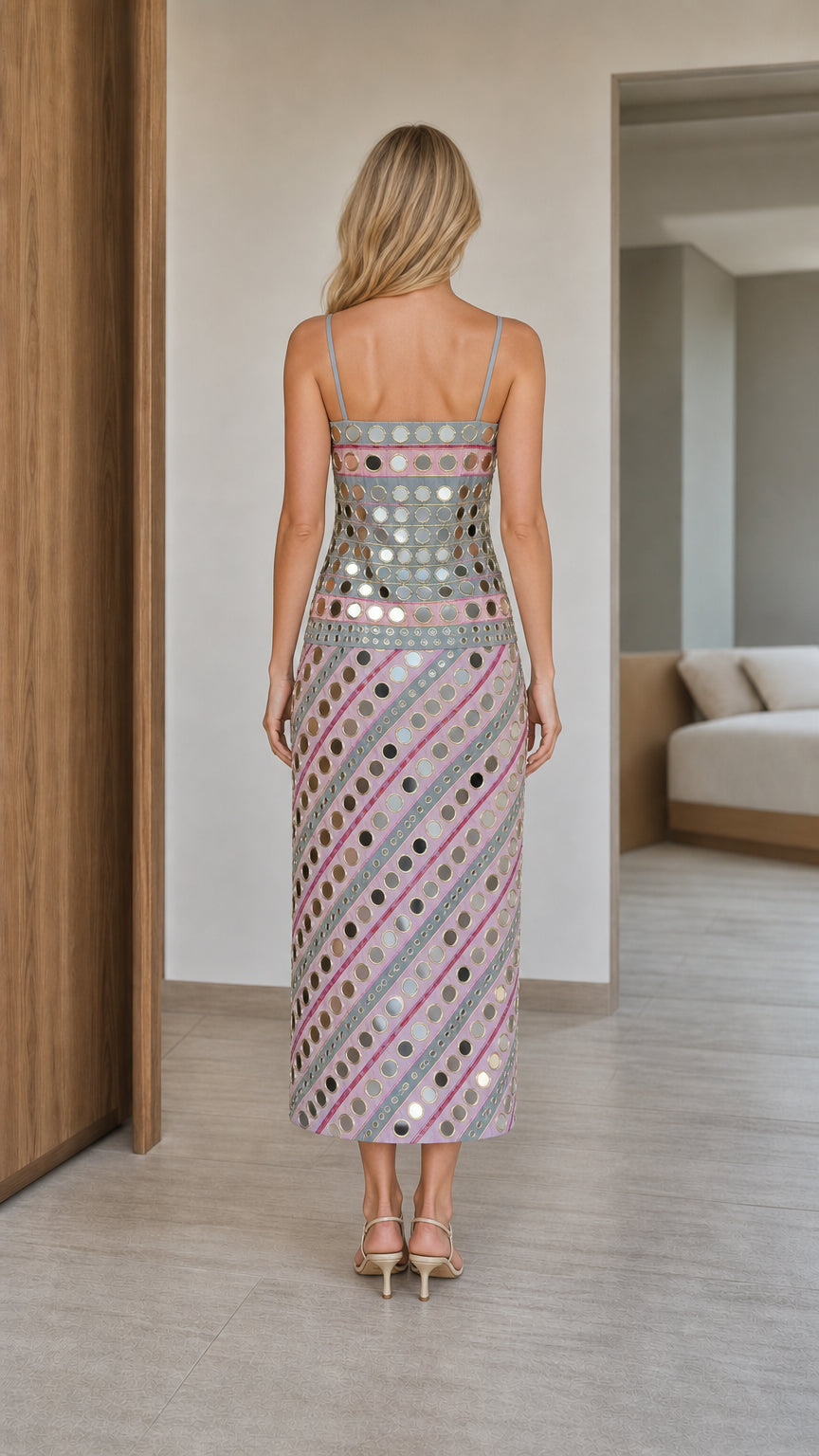 Back view of woman wearing pink mirror embroidered slip dress