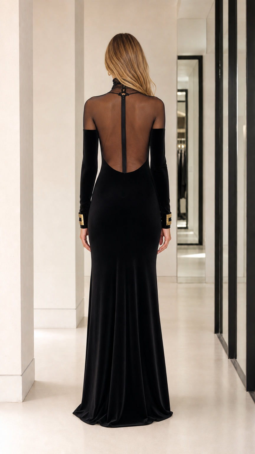 Back view showing sheer illusion panel and zipper on black evening gown