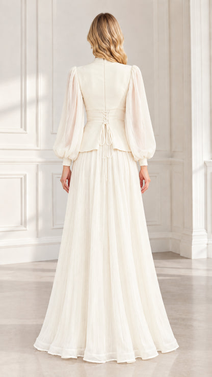 Back view of ivory evening gown highlighting adjustable corset lace-up waist detail