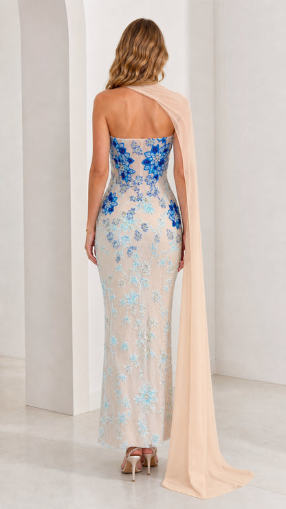 Back view of model in champagne column evening dress showing shoulder cape drape