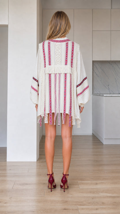 Back view of ivory boho embroidered kimono cardigan showing tassel trim details