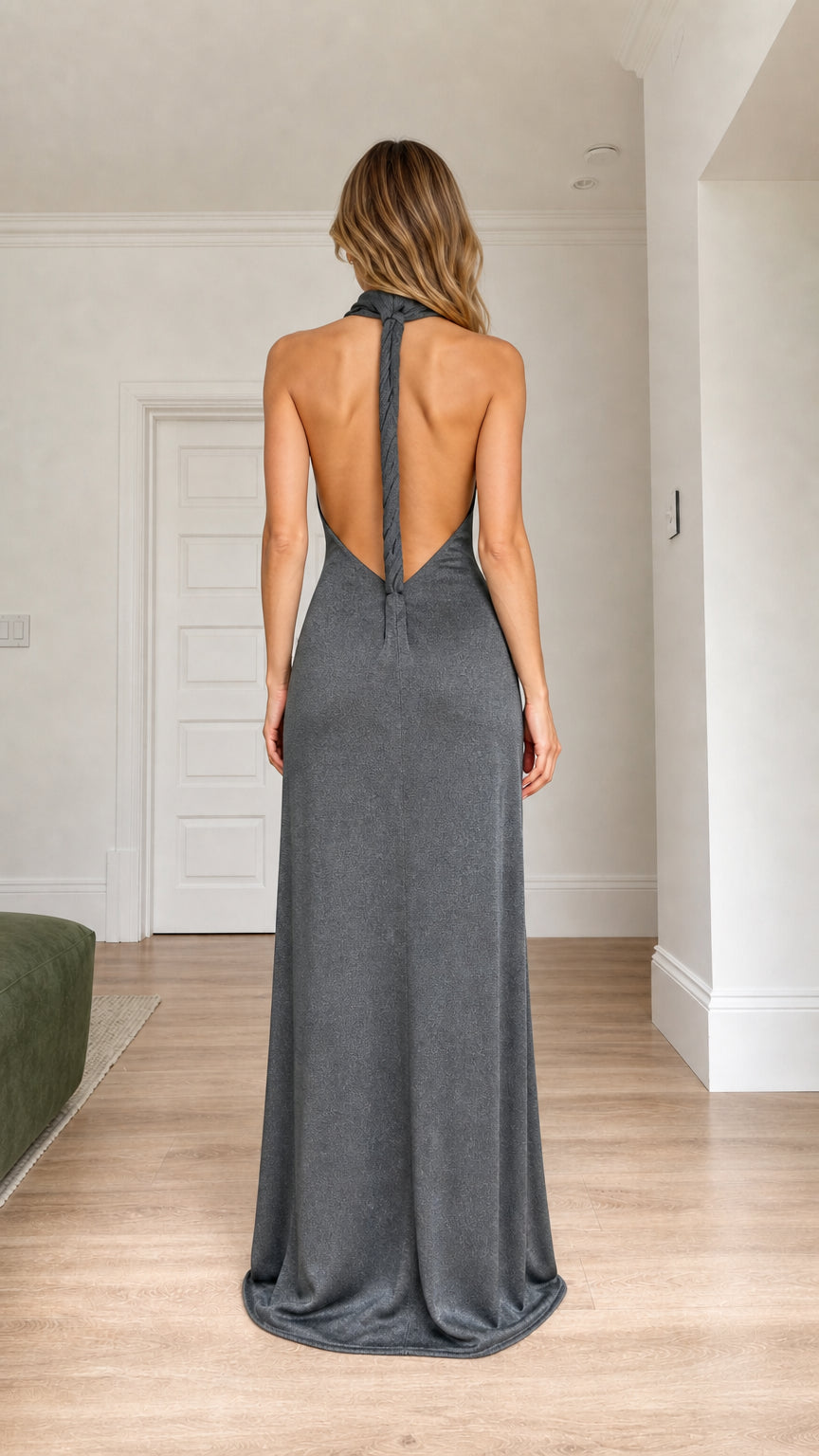 Back view of charcoal backless maxi evening gown showing low back design