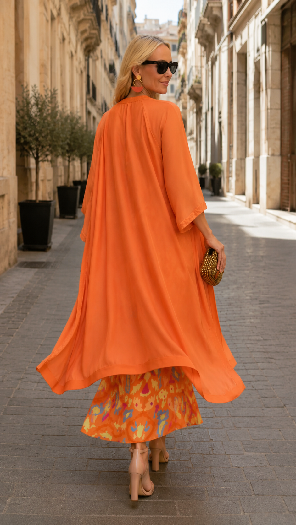 Orange printed sleeveless maxi dress with matching flowing cover up back view