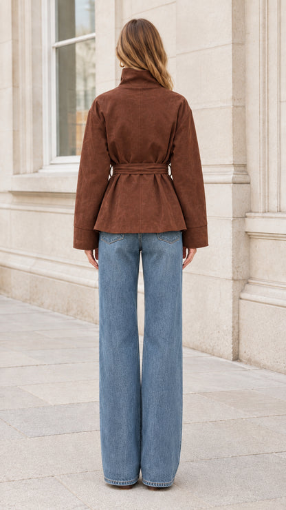 Back view of model wearing brown belted short jacket
