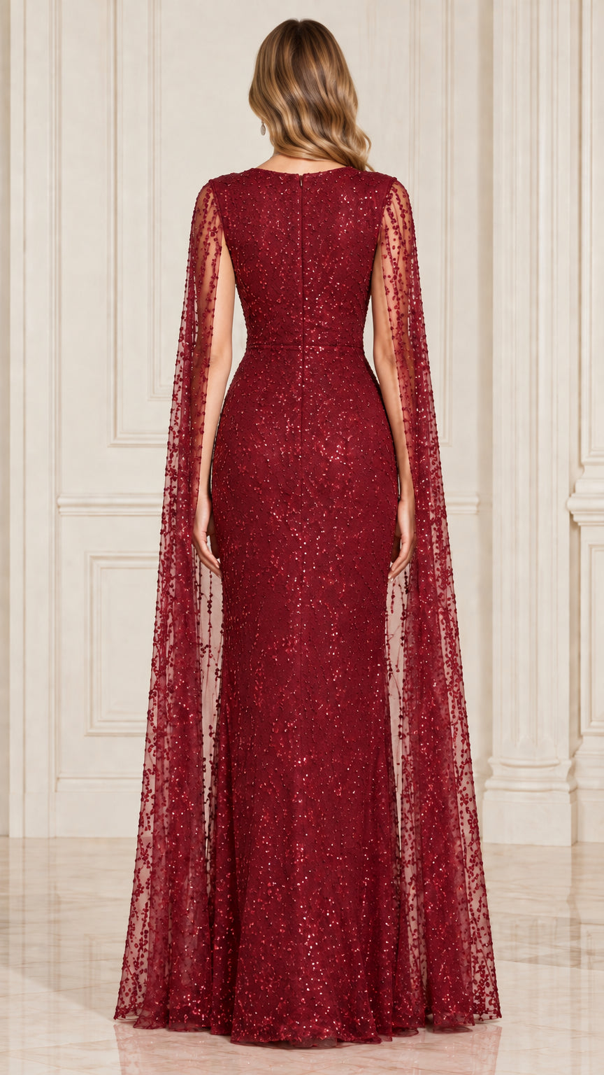 Back view of burgundy sequined evening dress with flowing cape panels