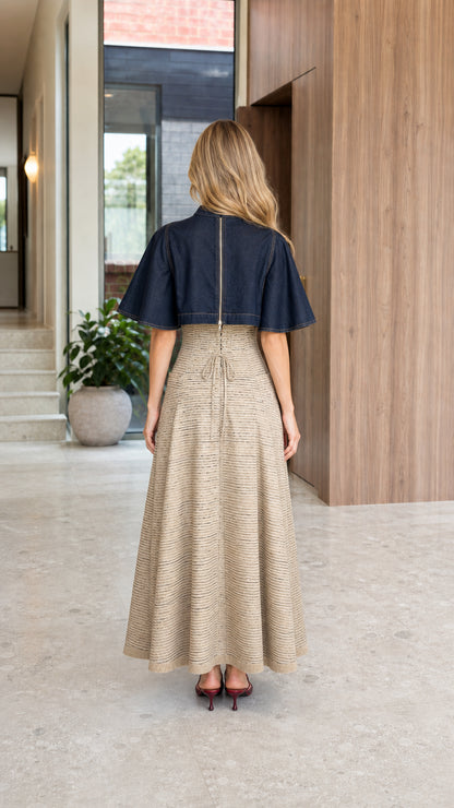 Back full-length view showing the capelet drape and back zipper of the Navy Blue dress