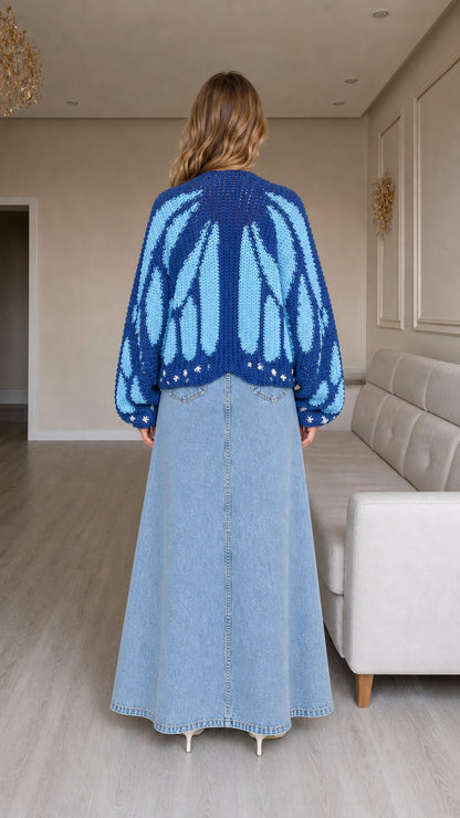 Back view of model showing the full butterfly wing knit pattern in blue