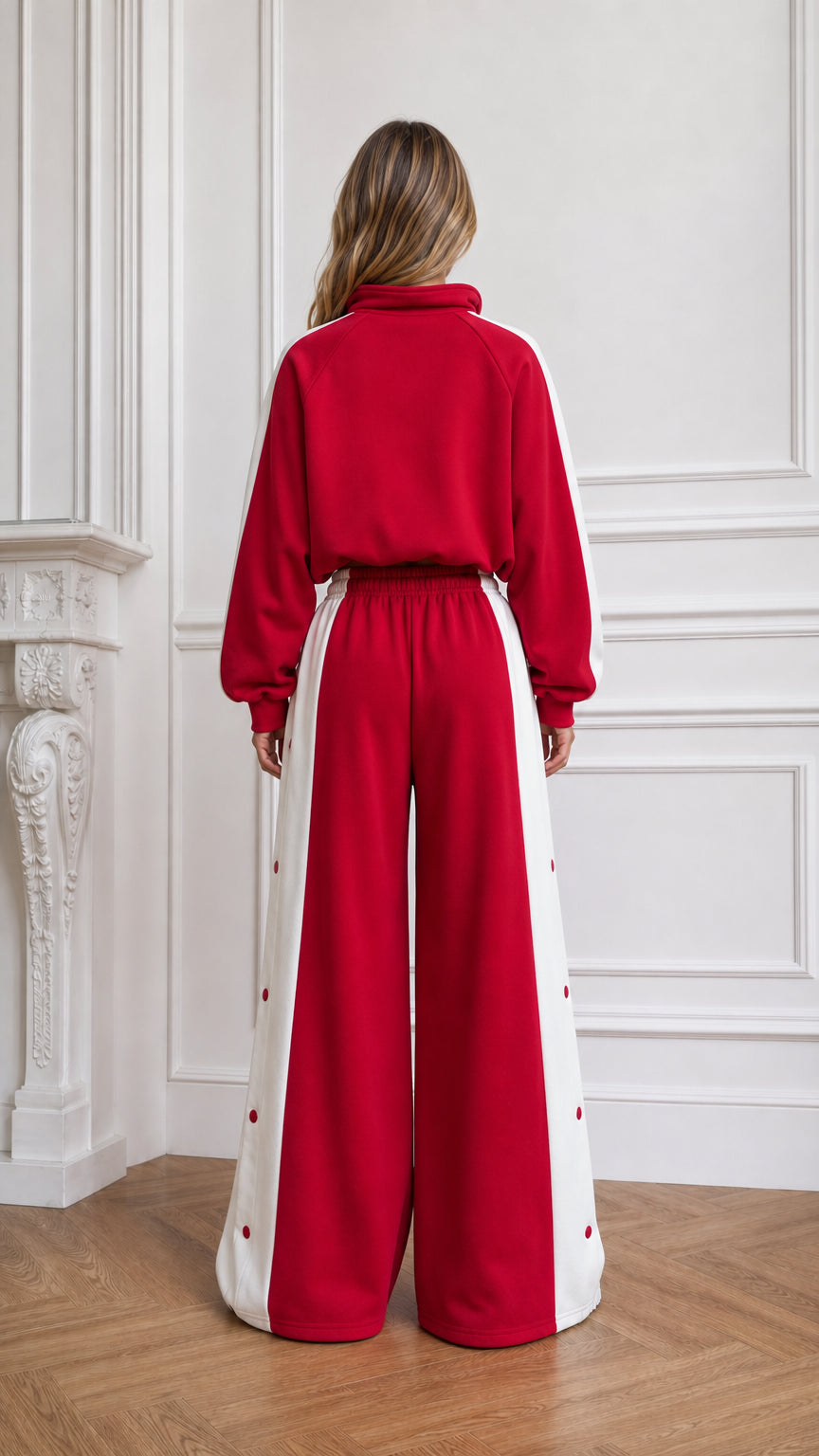 Back view of woman wearing red cropped hoodie and wide-leg pants set