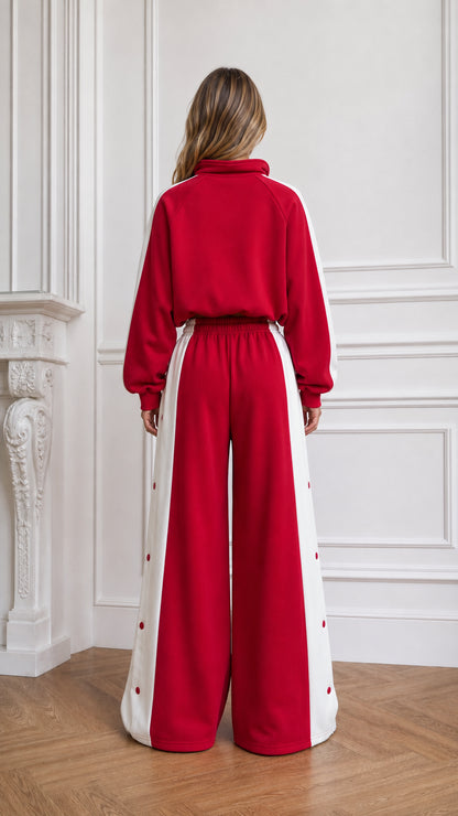 Back view of woman wearing red cropped hoodie and wide-leg pants set