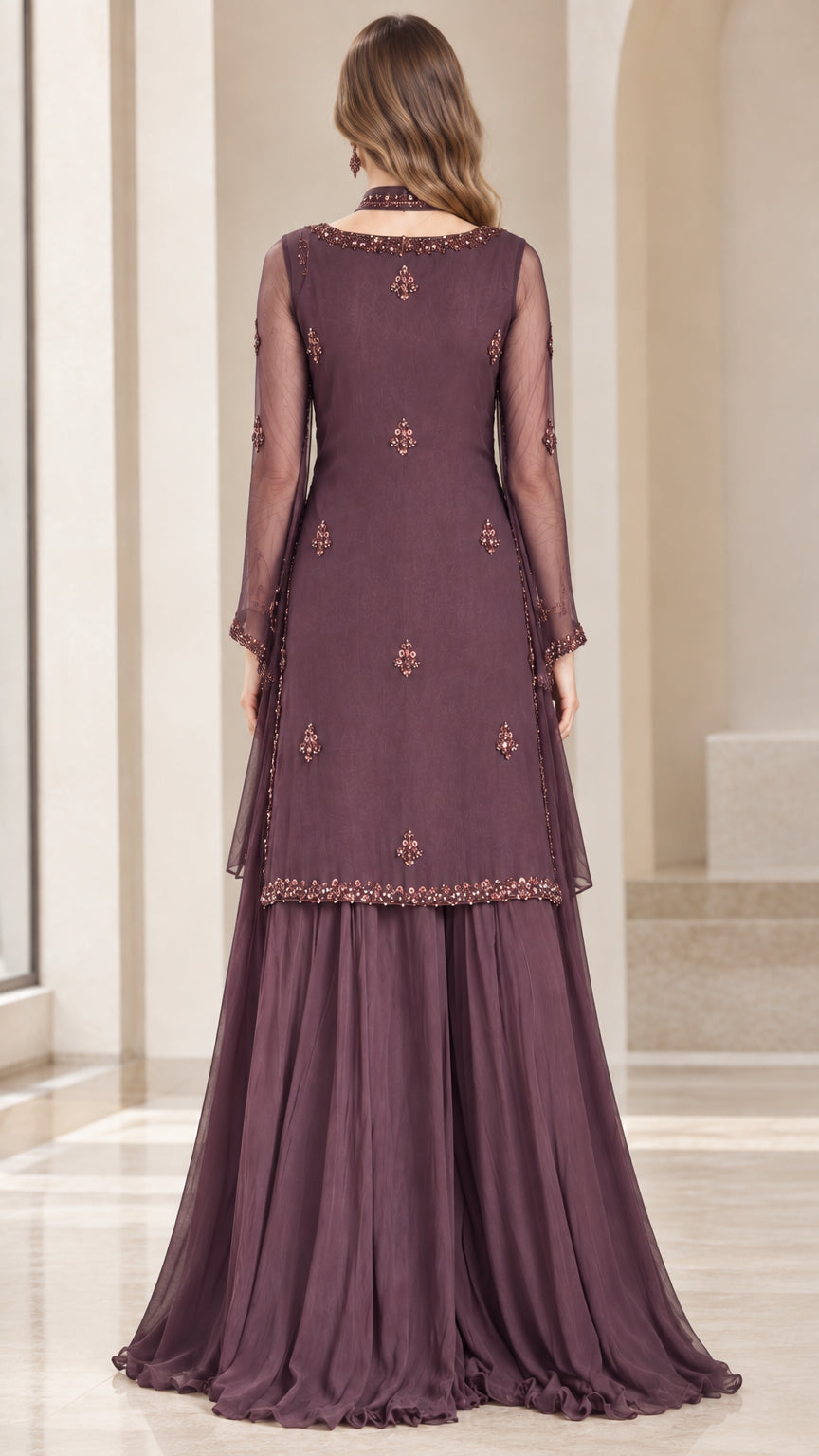 Back view of model wearing plum embellished evening tunic set
