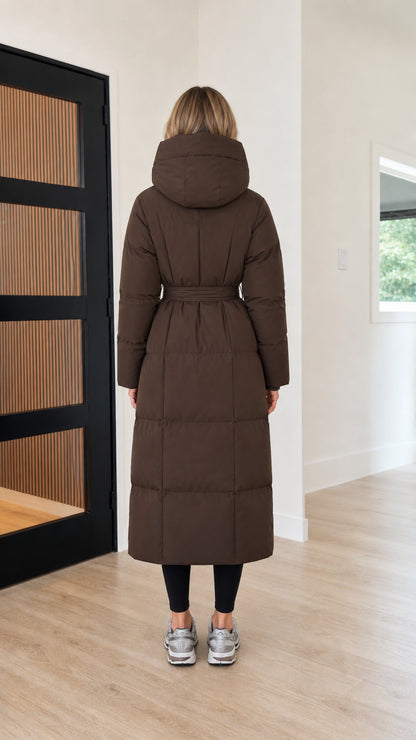 Back view of women's maxi length quilted puffer coat in chocolate brown
