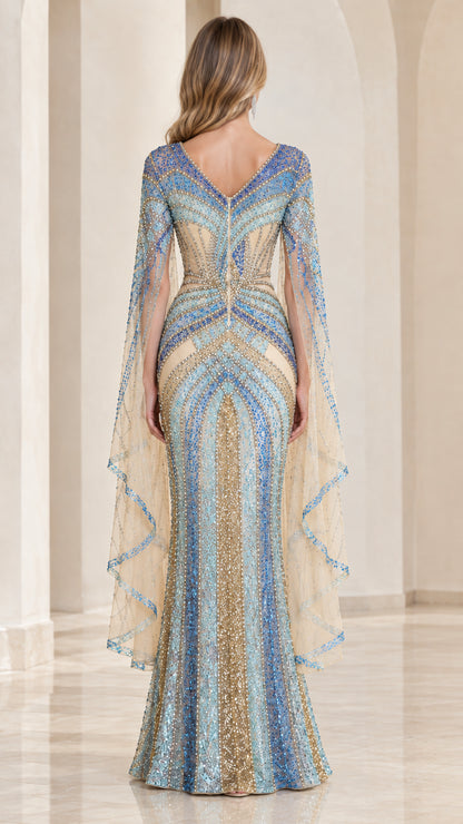 Back view of model in Sky Blue cape evening gown with V-back detail