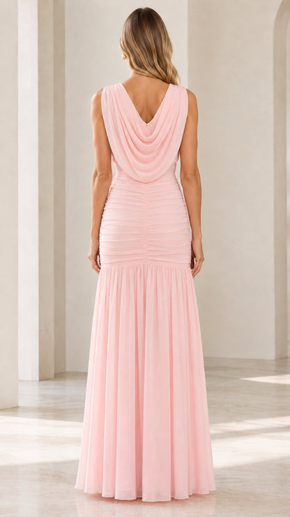 Back view of blush pink maxi dress highlighting the draped open cowl neckline