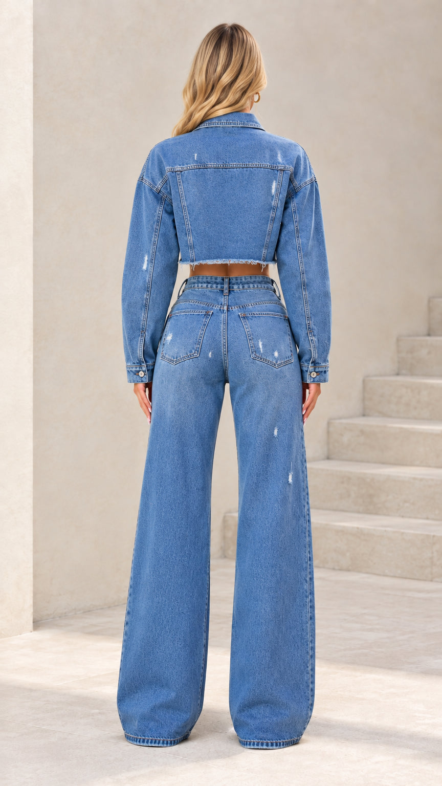 Back view of woman wearing Classic Blue 2-piece denim set showing cropped jacket cut and pocket placement