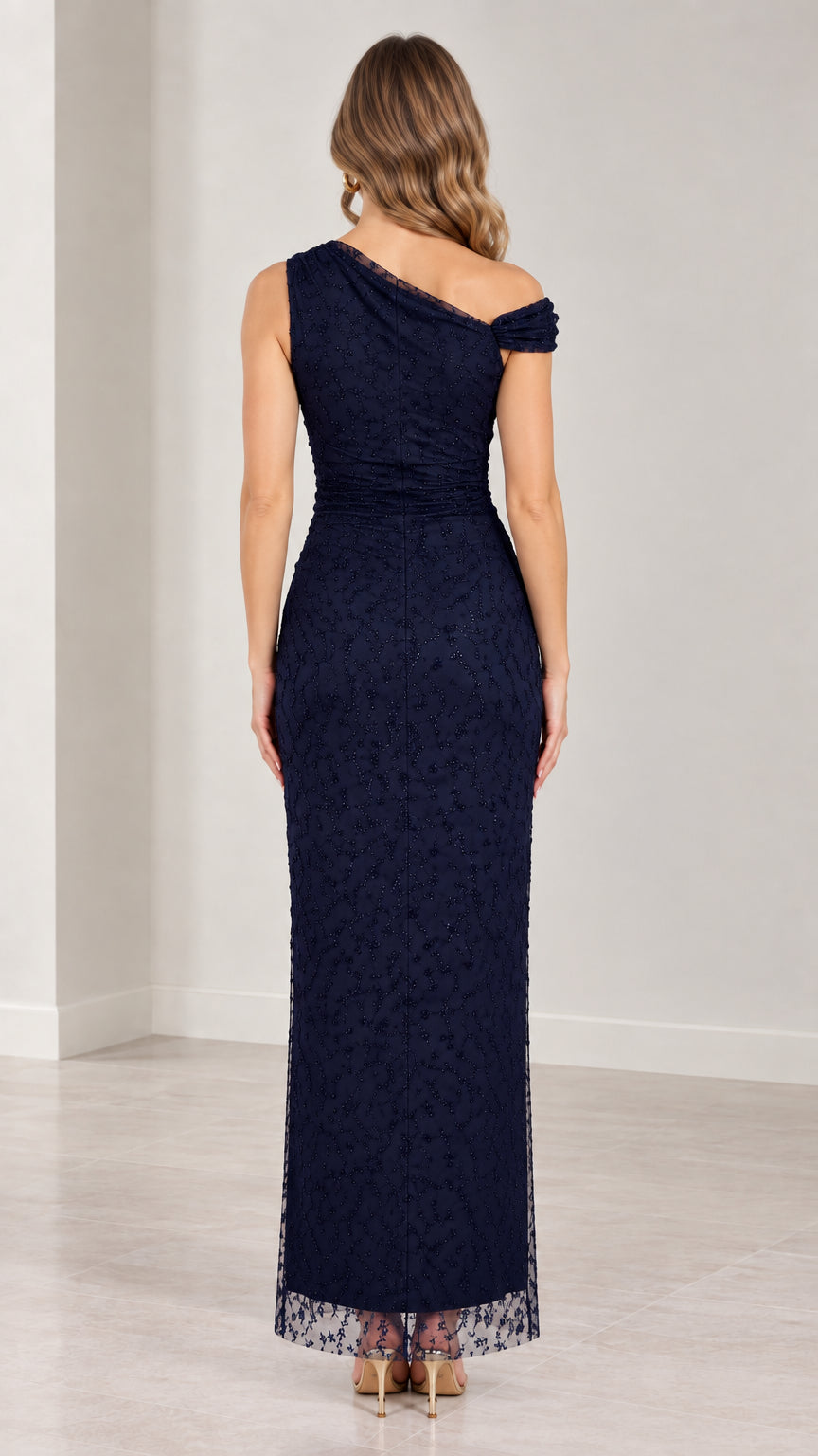Back view of navy blue one-shoulder floor-length evening dress