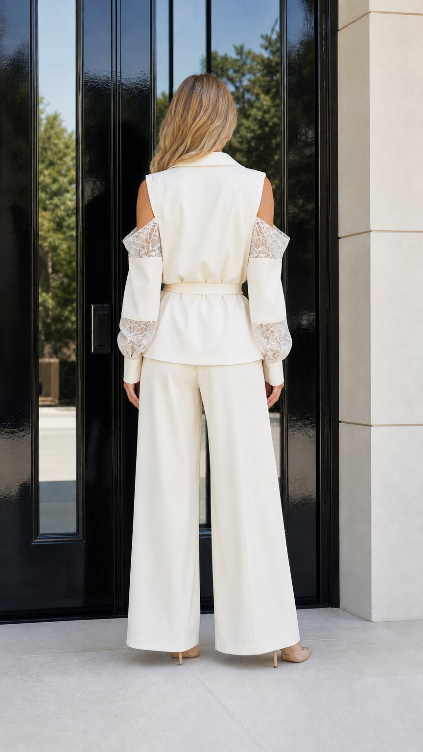 Back view of cream wide leg suit set with cold shoulder detail