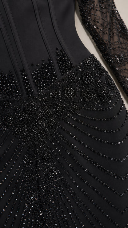 Close-up of black beaded pattern and structured bodice detailing