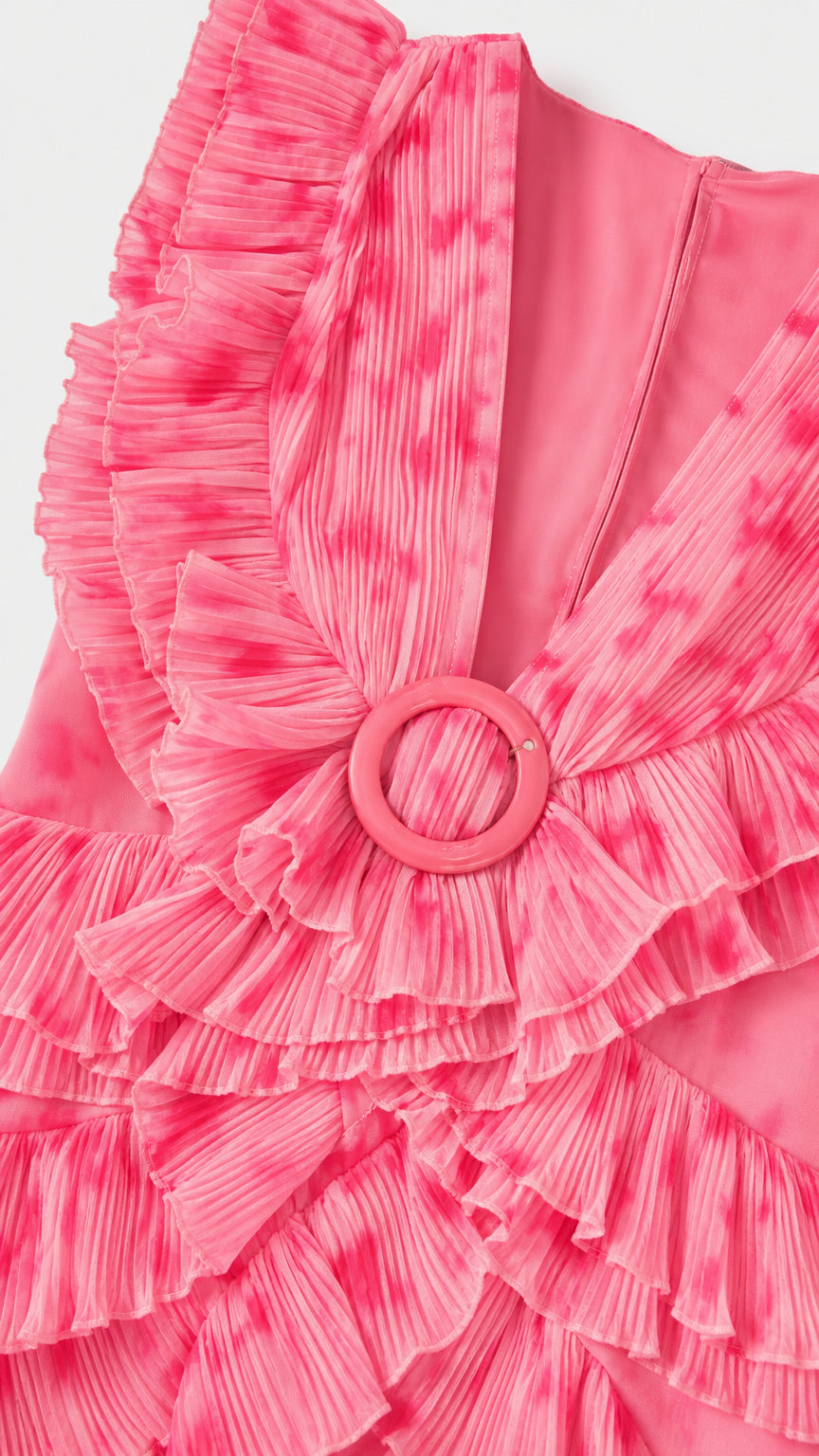 Close-up detail of micro-pleated ruffles and center ring accent on Hot Pink dress bodice