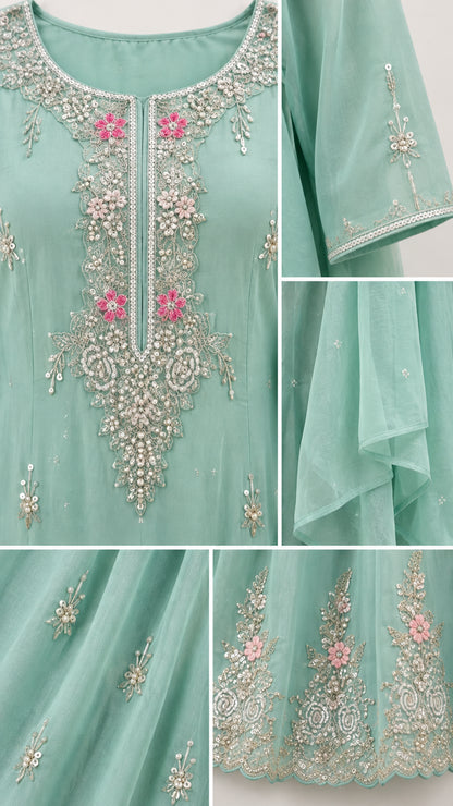 Detailed closeup of floral beadwork embroidery on neckline, cuffs, and hem