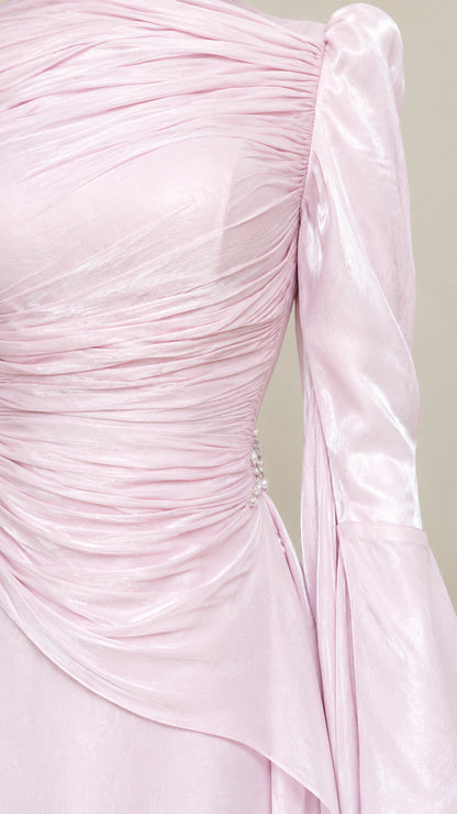 Close-up detail of gathered ruched bodice and draped waist detail with side embellishment
