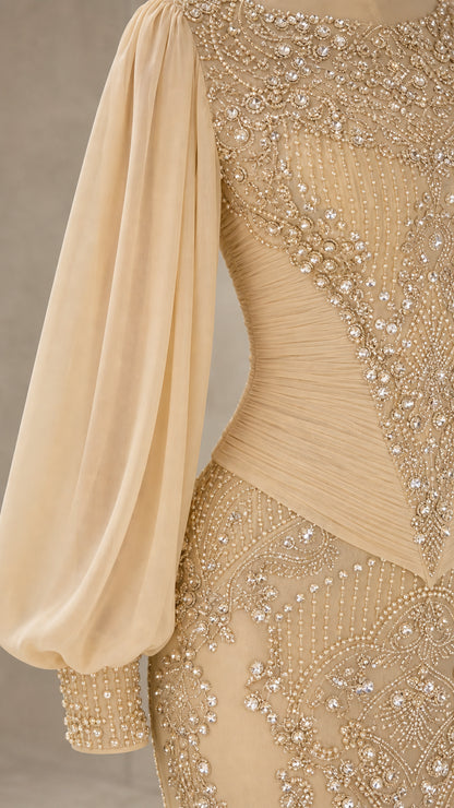 Close-up detail of Champagne gown showing beaded embroidery and pleated waist