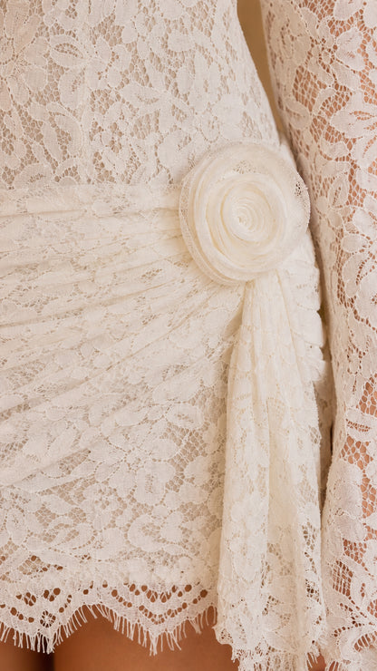 Close-up detail of the 3D rosette applique and delicate floral lace texture