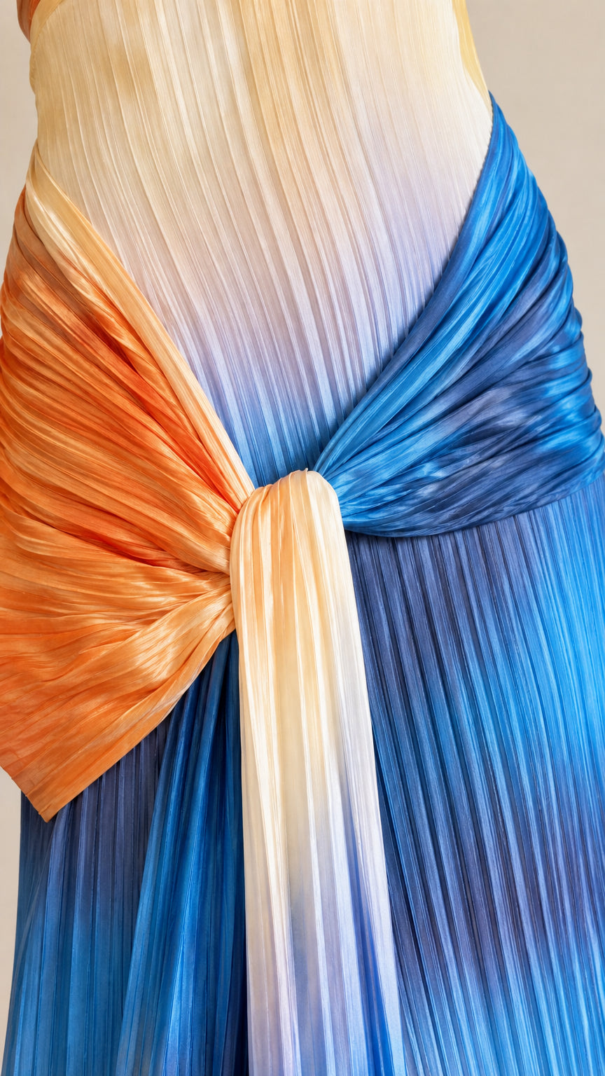 Close-up detail of pleated texture, multi-color gradient, and side knot accent