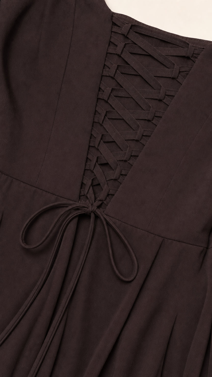 Close-up detail of the adjustable lace-up corset back on chocolate brown formal dress