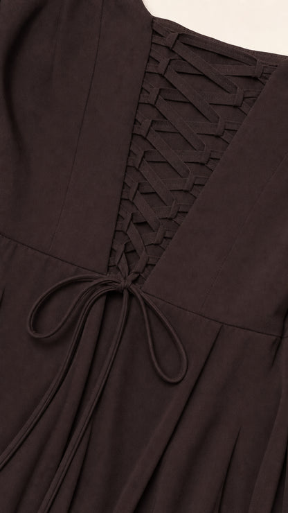 Close-up detail of the adjustable lace-up corset back on chocolate brown formal dress