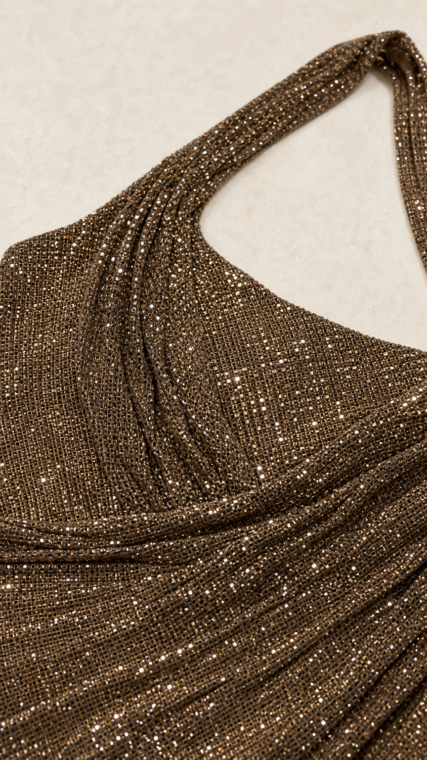 Close up texture of bronze metallic shimmer lurex fabric