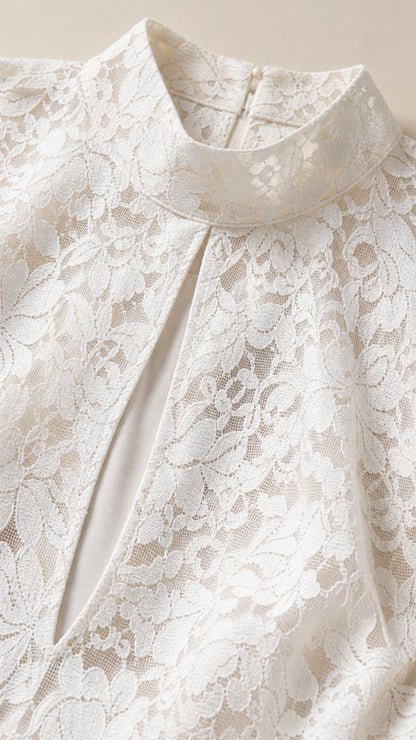 Close up detail of high mock neck and keyhole cutout in white lace dress
