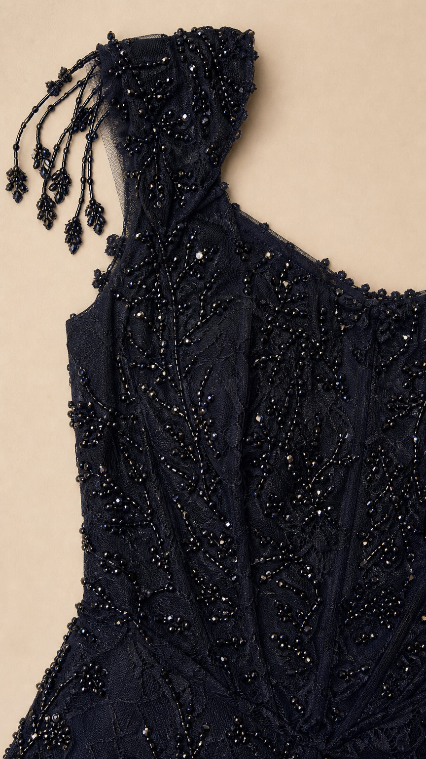 Close-up detail of shoulder beadwork and square neckline