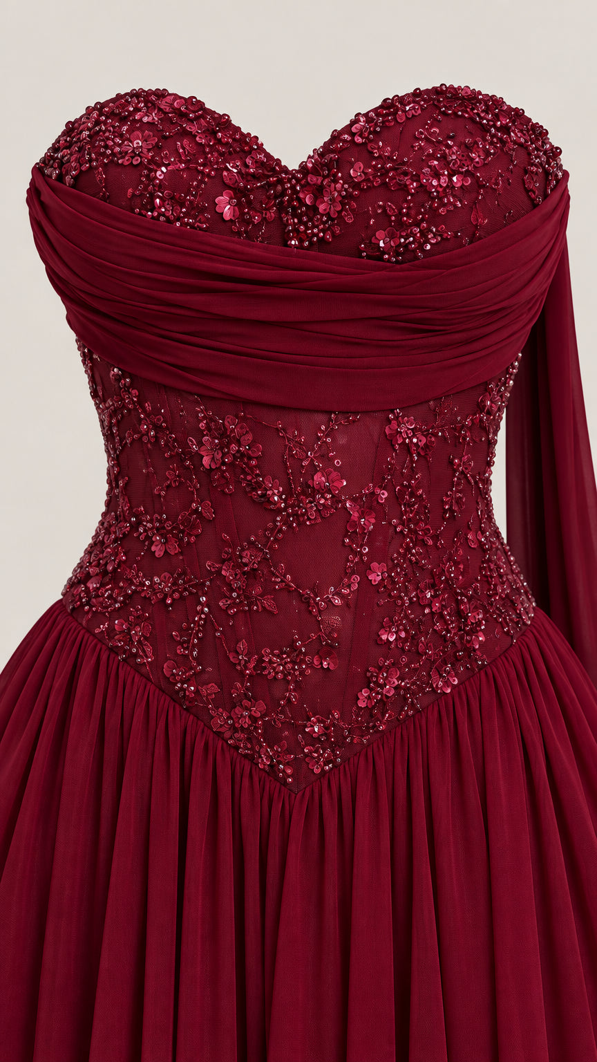 Close-up detail of sweetheart neckline and beaded embroidery on burgundy bodice