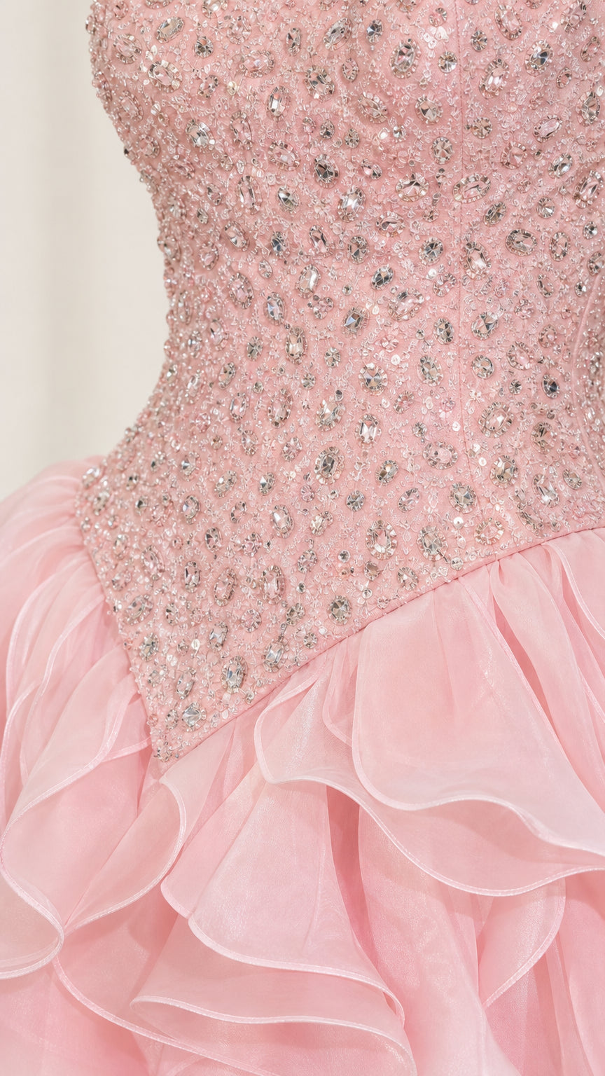 Close-up detail of the crystal and rhinestone beaded bodice on the baby pink gown