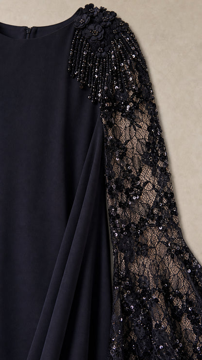 Close-up detail of shoulder floral beading and sheer lace flared sleeve