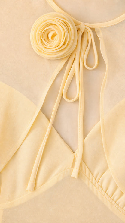 Close-up detail of Butter Yellow 3D fabric flower rosette and tie neckline