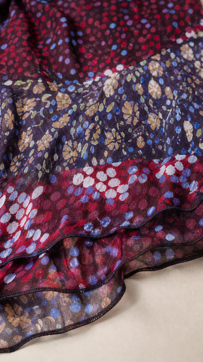 Close-up detail of sheer printed floral and dotted ruffle fabric