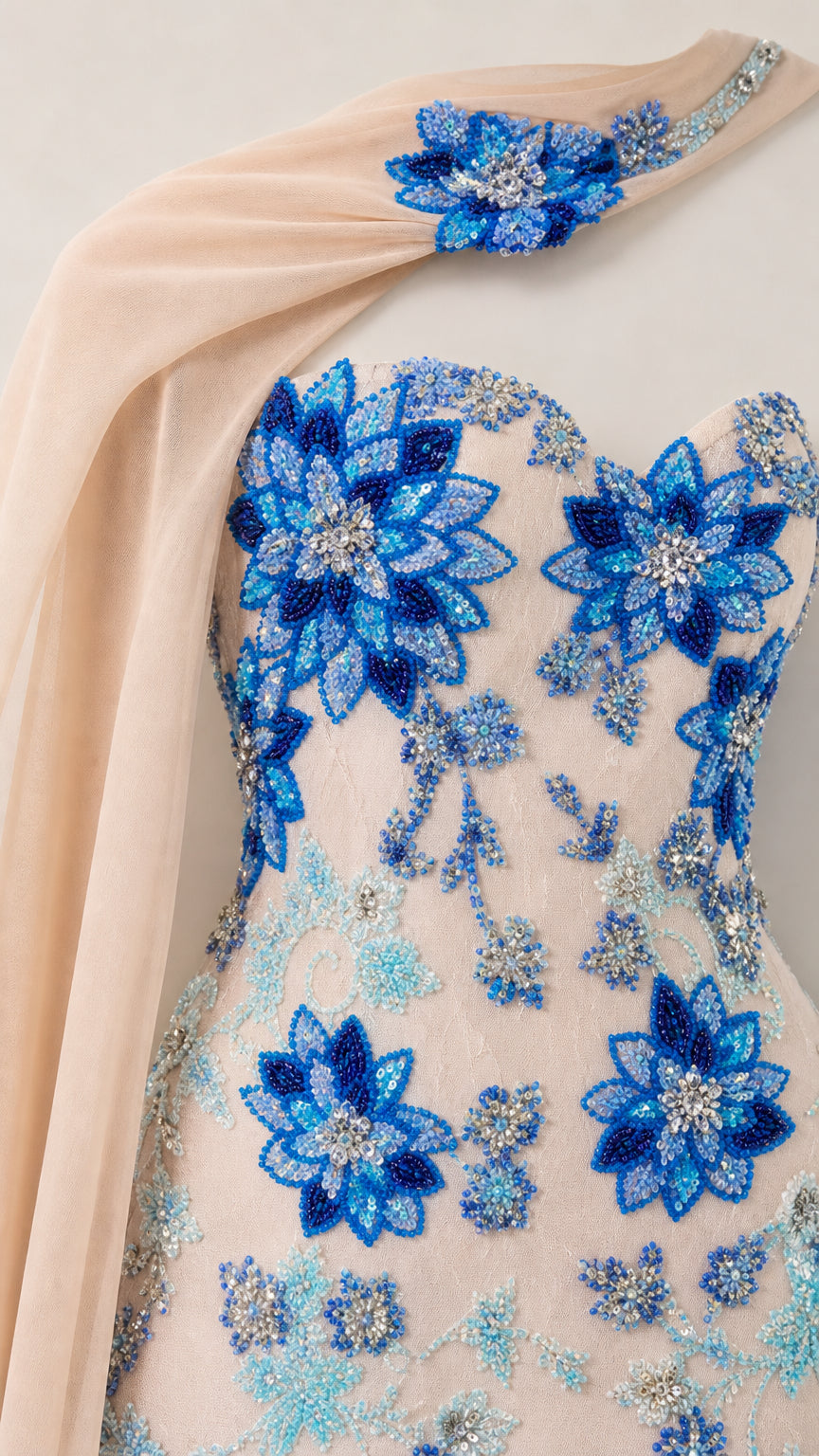 Close-up detail of intricate blue floral beadwork on sweetheart bodice and neck collar