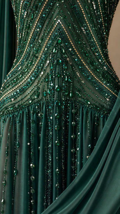 Close-up detail of green beaded embroidery and sequins on bodice