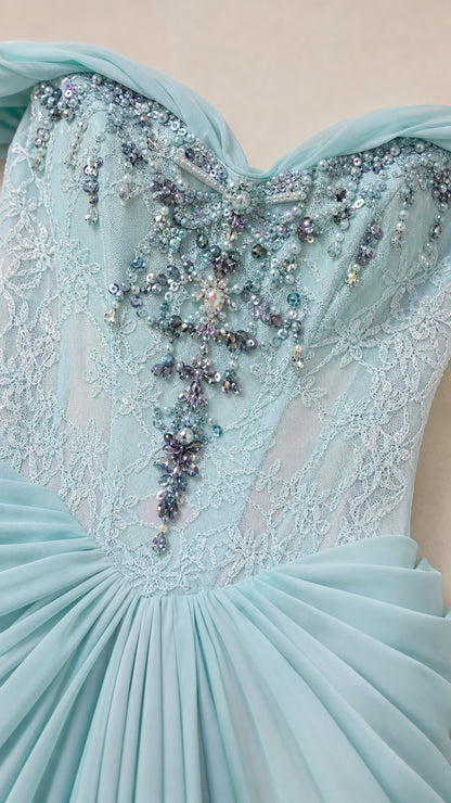 Detailed close-up of intricate beaded and sequin lace embroidery on the bodice