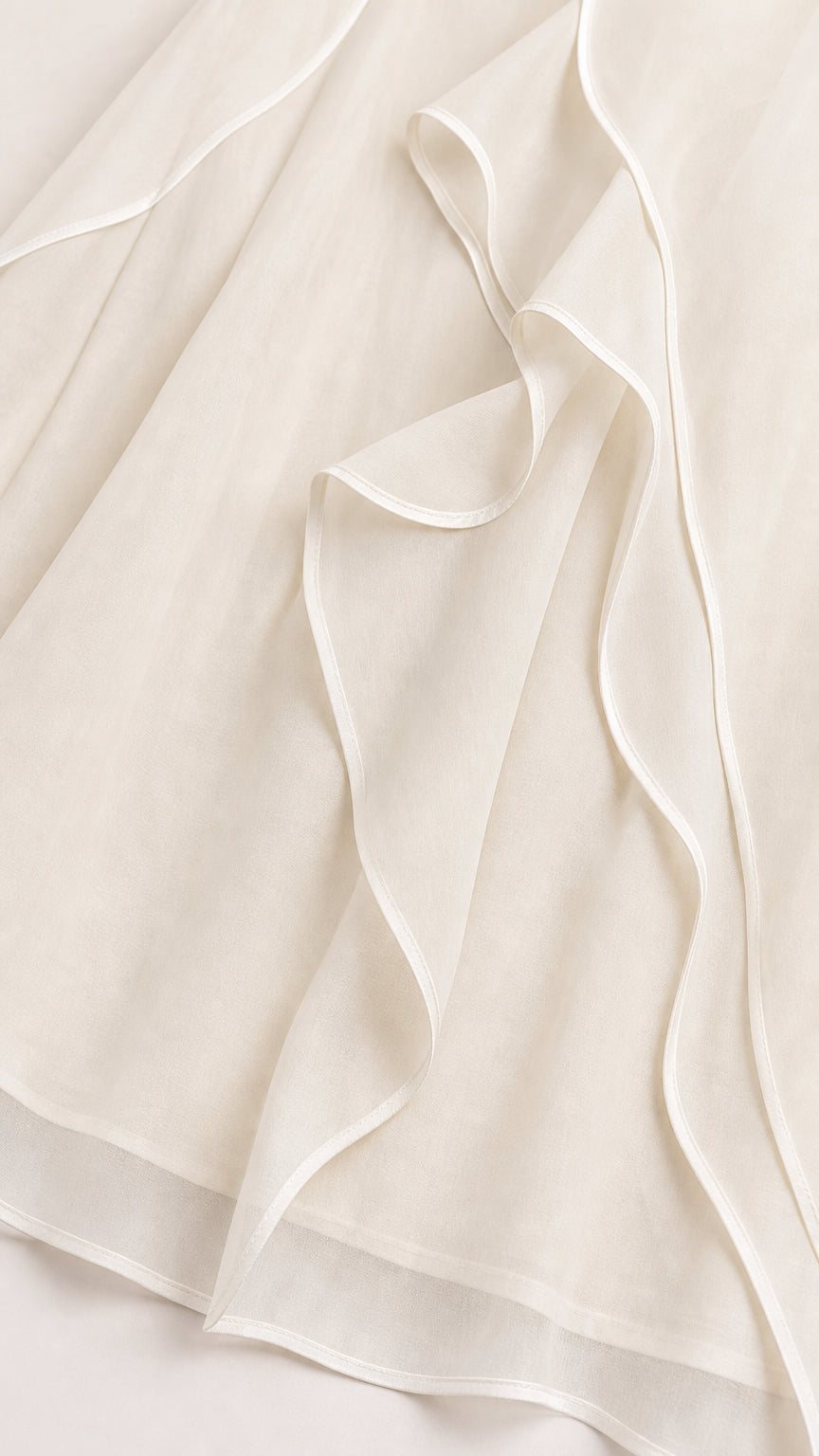 Close-up detail of cascading tiered ruffle chiffon hemline