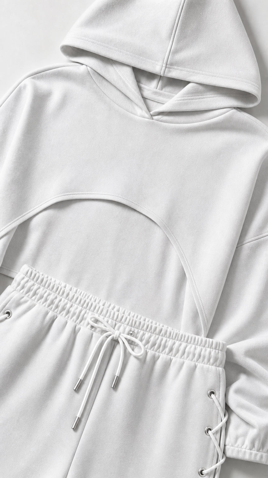 Close-up detail of white crop hoodie and drawstring waistband with lace-up eyelets