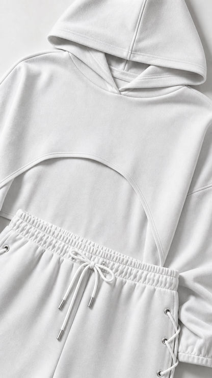 Close-up detail of white crop hoodie and drawstring waistband with lace-up eyelets