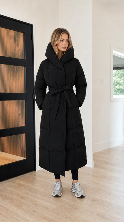 Women's long belted maxi hooded puffer jacket in classic black