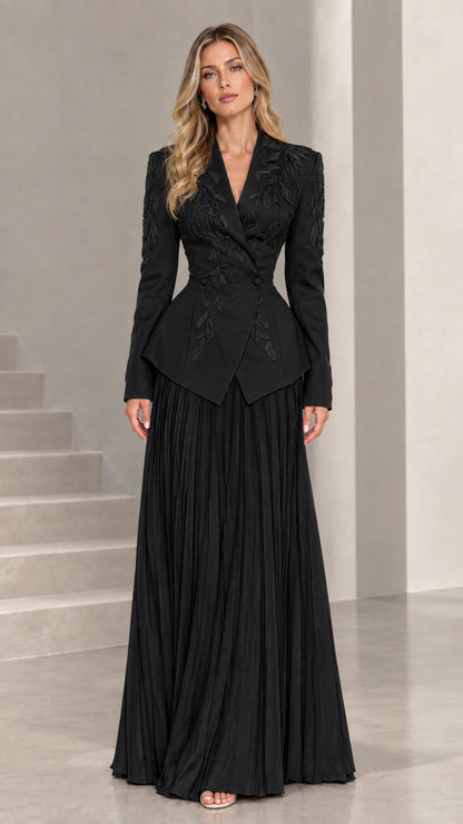 Full-length view of black embroidered peplum blazer and pleated maxi evening suit