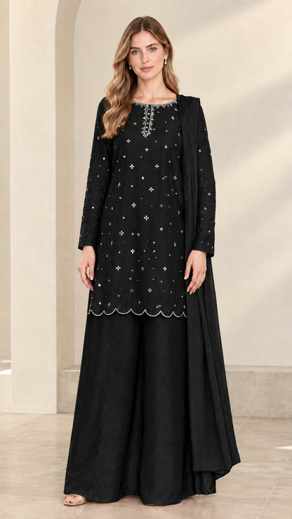 Full-length front view of black embellished tunic and wide-leg pant set with scarf