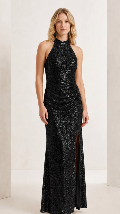 Front full-length view of model wearing the classic black halter sequin evening maxi gown